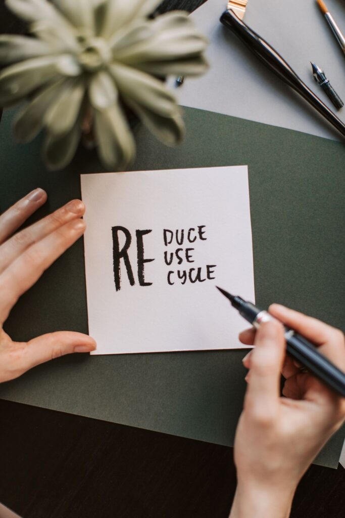 Handwritten note reading reduce, reuse, recycle